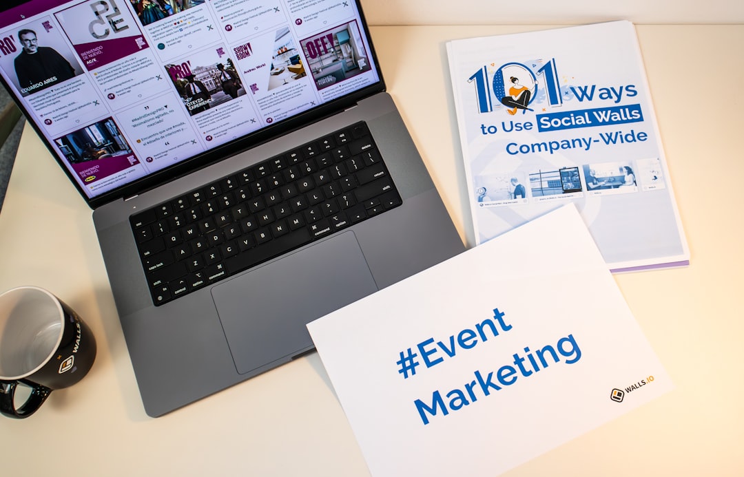 services-01 A desk with documents, a piece of paper with the hashtag #EventMarketing and a laptop showing a social media wall